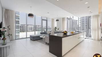 Luxury Apartment | Living area | 65-inch Smart TV with cable channels