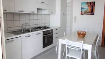 Basic Apartment, 1 Bedroom, Sea View | Private kitchen | Full-size fridge, oven, stovetop, cookware/dishes/utensils