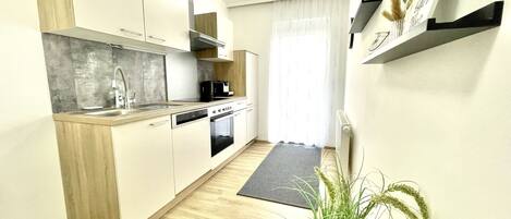 Deluxe Apartment | Private kitchen | Espresso maker, coffee/tea maker, electric kettle