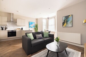 One Bedroom Apartment - Sleeps 4 | Living area | 40-inch Smart TV with digital channels