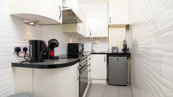 Fridge, microwave, coffee/tea maker, toaster