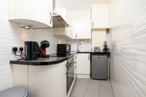 Fridge, microwave, coffee/tea maker, toaster