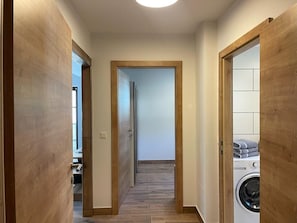 Access the laundry area through this convenient hallway with a door on either side.