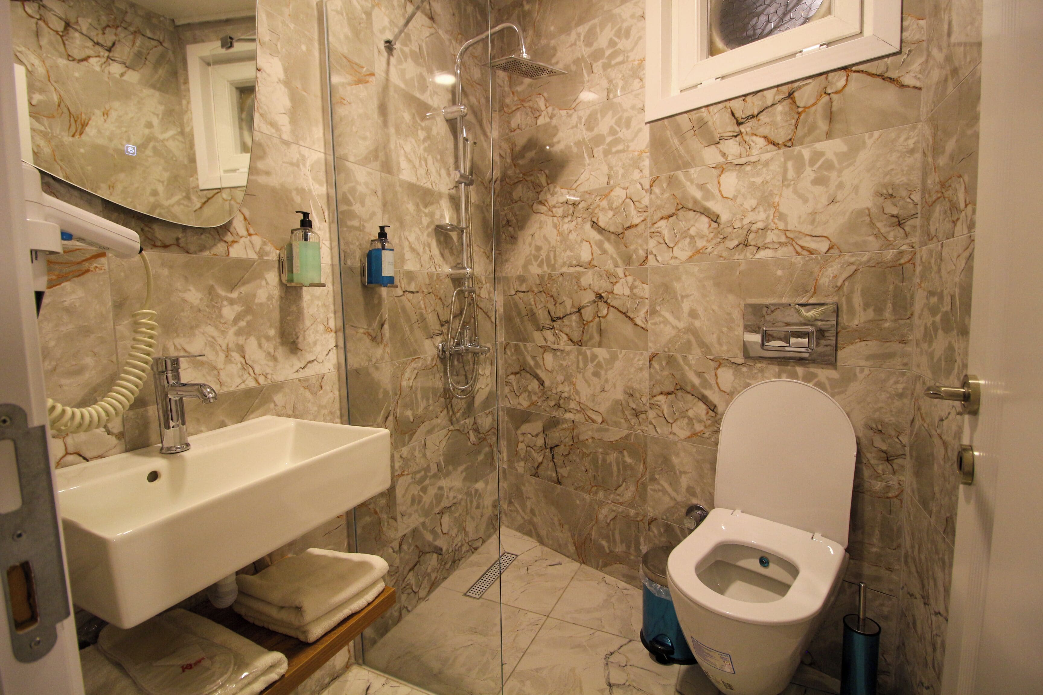 shower, hair dryer, bathrobes, slippers