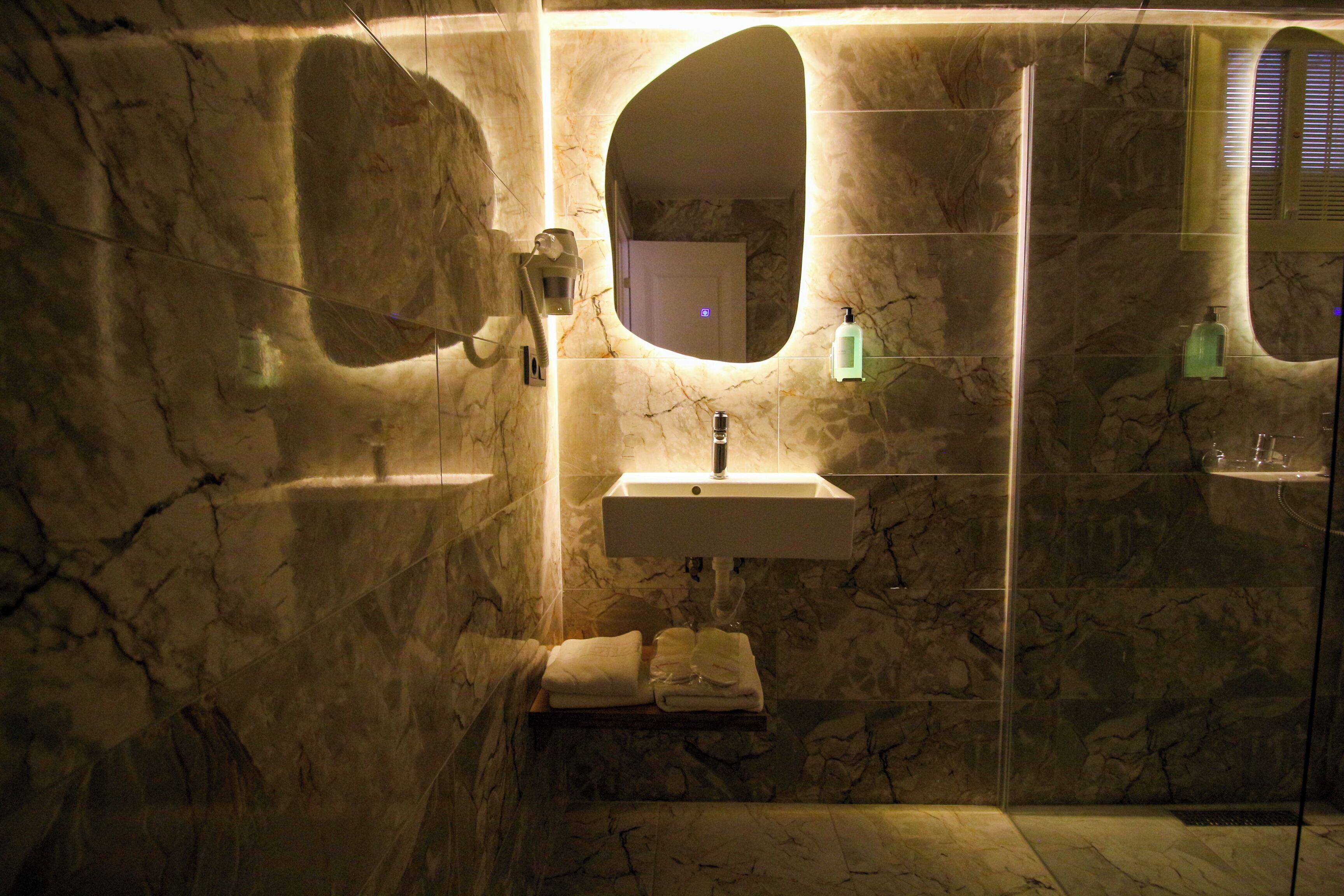 shower, hair dryer, bathrobes, slippers