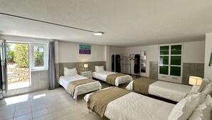 A hotel room with two beds, a bathroom, a balcony, and a view of the outdoors. - Abby by Check-in Portugal (Albufeira)