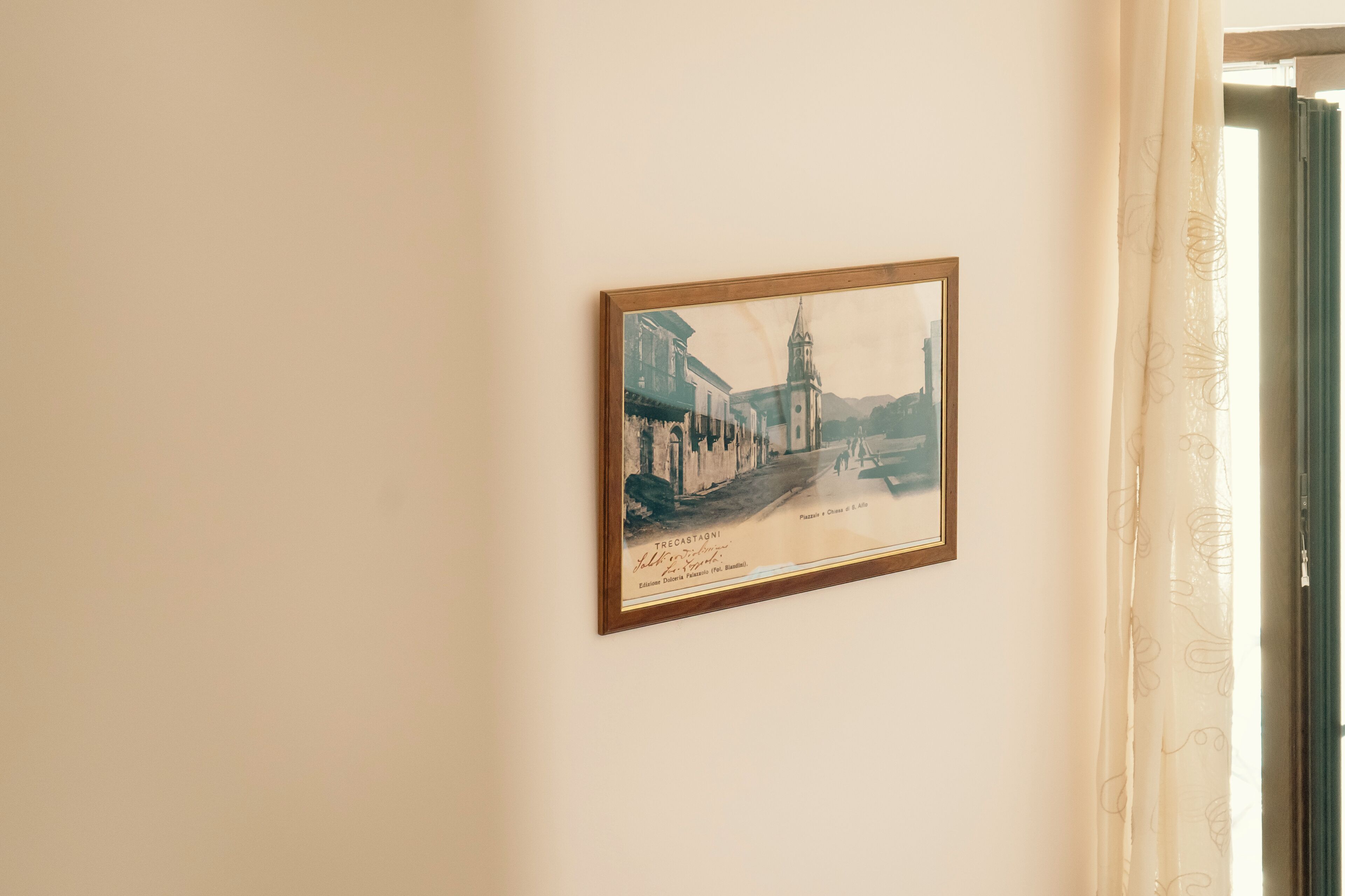 A framed historical photograph on a wall.
