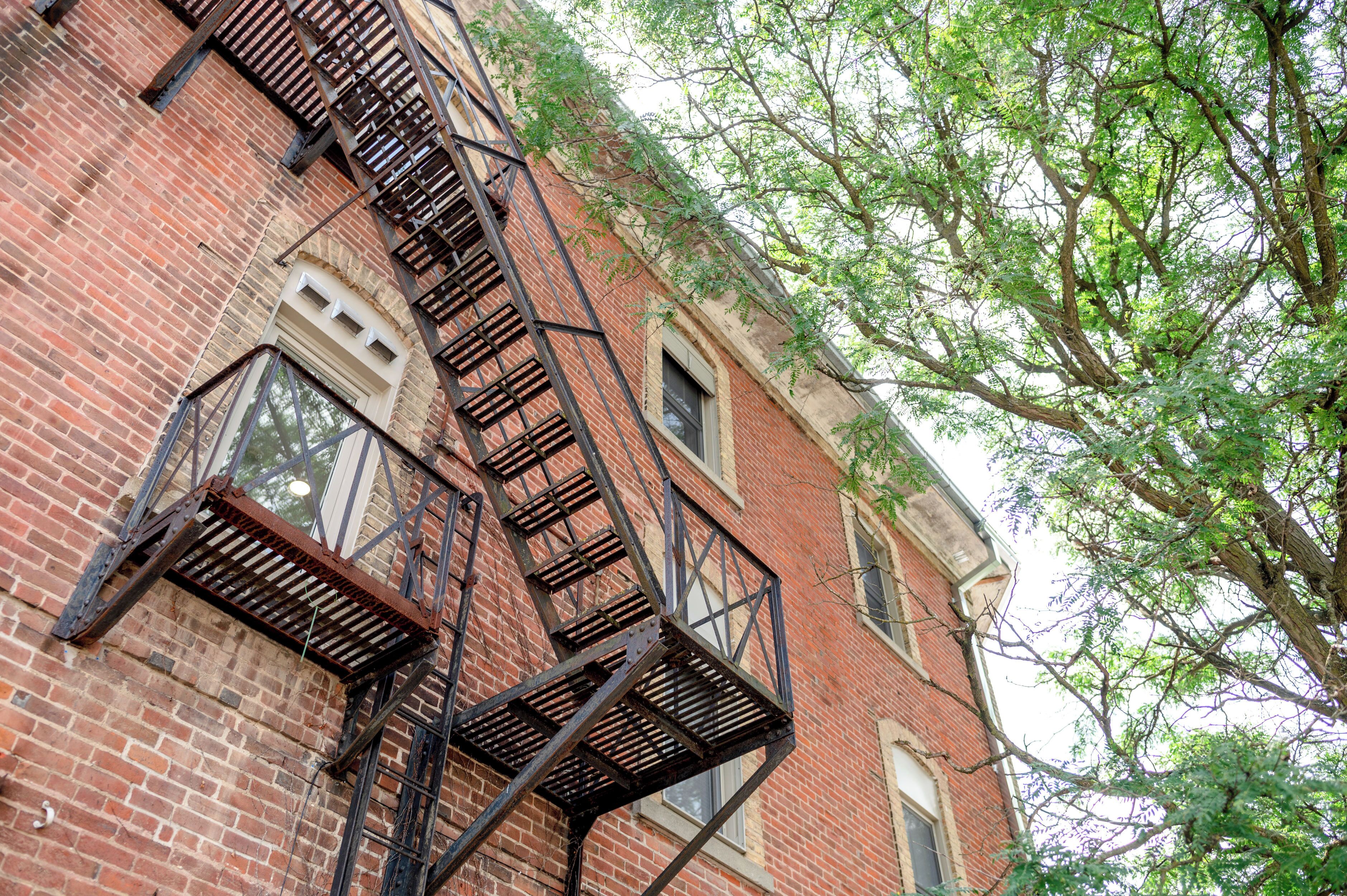 A brick building with a fire escape.