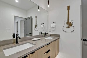Shower, hair dryer, towels, shampoo