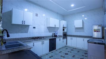 Apartment, Multiple Beds | Private kitchen