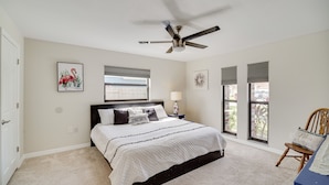 A bedroom with a bed, a ceiling fan, a window with blinds, and a chair. - 'space Coast' Getaway w/ Outdoor Pool & Spa! (Palm Bay)