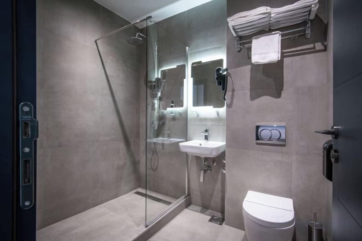 Bathroom | Hair dryer, slippers, towels