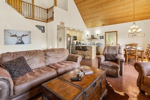 Smart TV, fireplace, books, computer monitors