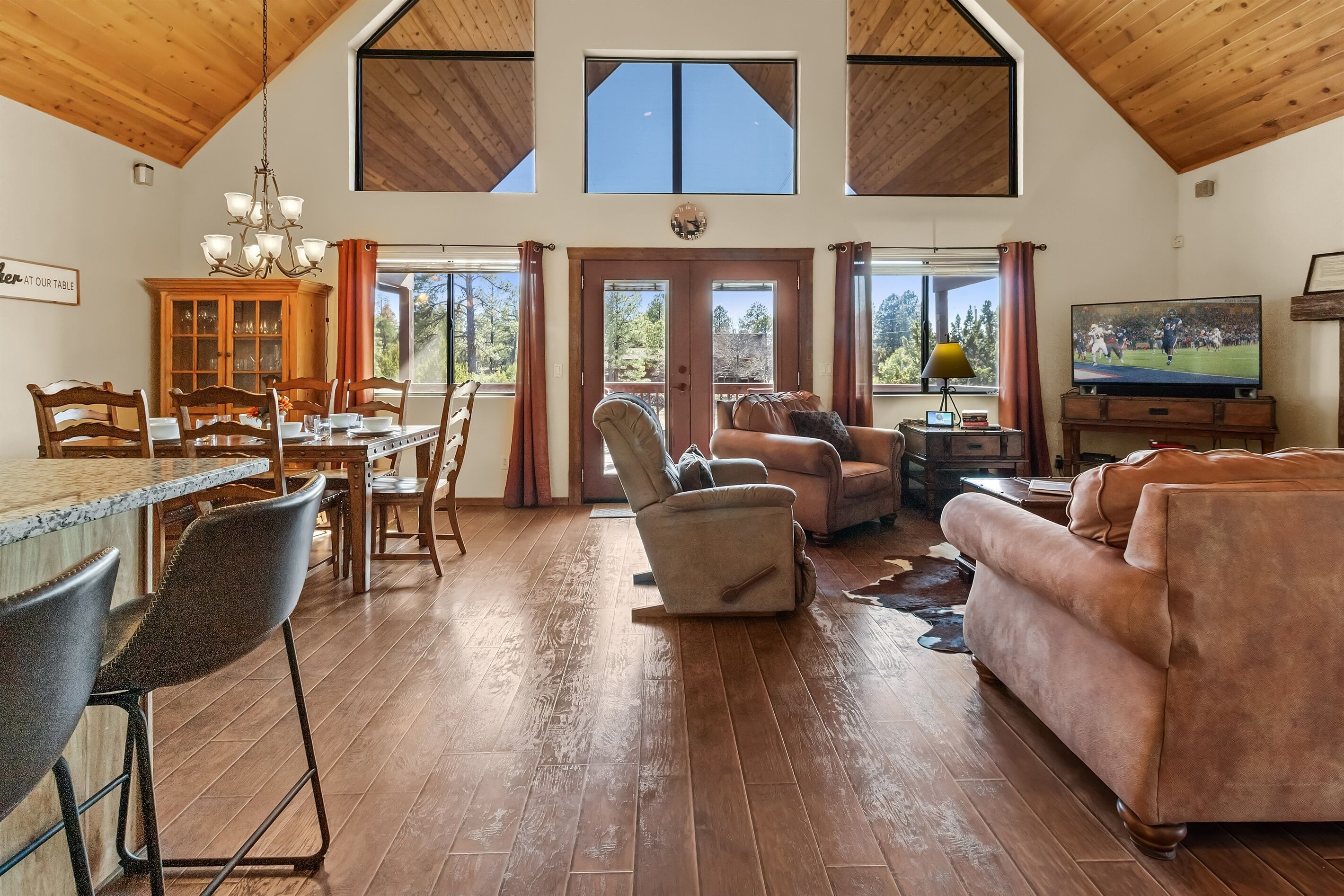 Smart TV, fireplace, books, computer monitors