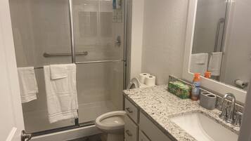 Shower, hair dryer, towels, soap