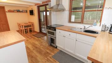 Fridge, electric kettle, toaster, cookware/dishes/utensils