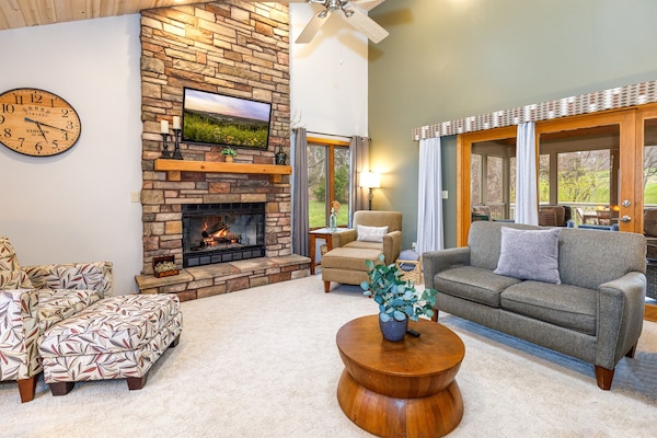Warm and inviting living room with a gas fireplace and plenty of space for all to gather