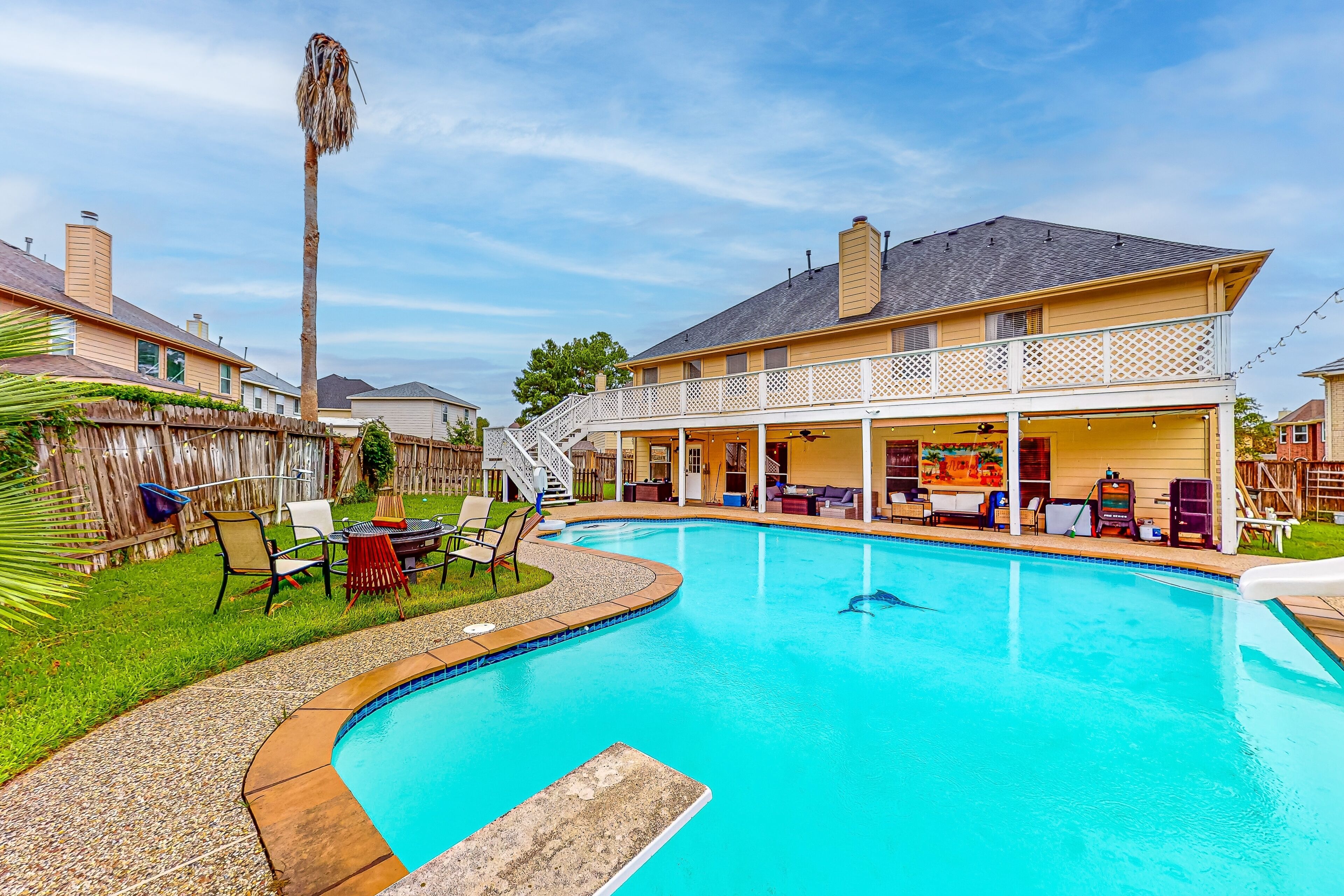 Sprawling home with enclosed yard, pool, balcony, fireplaces, & AC - dogs ok