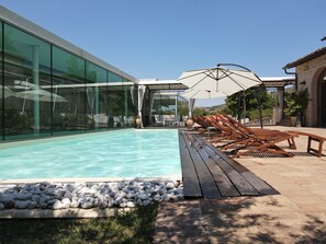 Seasonal outdoor pool, pool umbrellas, pool loungers