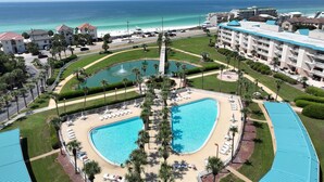 A resort with a large pool, a fountain, and a beach area. - Completely Remodeled, 2 Kings, Bunkroom, Beach Service  (Miramar Beach)