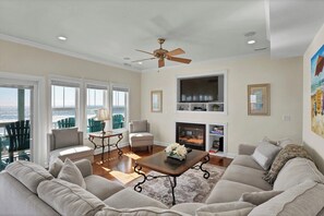TV, fireplace - Experience beachfront luxury at 1128 Sweet Carolina Discounts for open 2026 dates (North Topsail Beach)