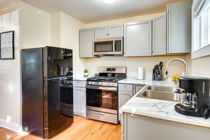 Fridge, microwave, stovetop, coffee/tea maker