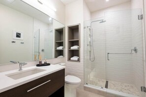 Shower, hair dryer, towels, soap - Cotton, Silk, and Linen at the Brent Lofts (Pensacola)