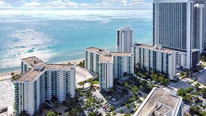 A high-rise hotel with multiple floors, a rooftop pool, and a view of the ocean. - Direct access to beach and heated pool at The Tides (Hollywood)