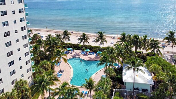 A resort with a pool, beach, and ocean view. - Direct access to beach and heated pool at The Tides (Hollywood)