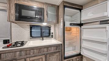 Fridge, microwave, stovetop, coffee/tea maker