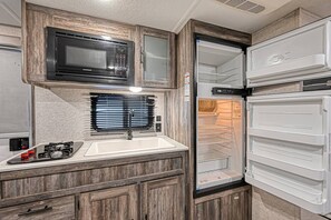 Fridge, microwave, stovetop, coffee/tea maker