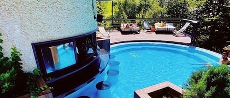 2 outdoor pools, pool umbrellas, lifeguards on site