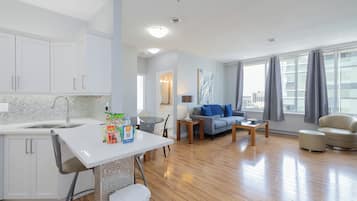 Comfort Apartment, 2 Bedrooms | Living area | 42-inch flat-screen TV with digital channels