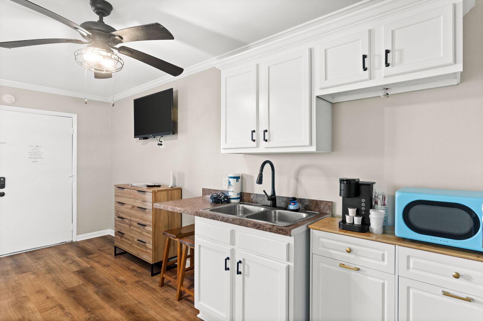 Fridge, microwave, coffee/tea maker, cookware/dishes/utensils