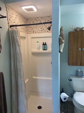 Shower, hair dryer, towels, soap