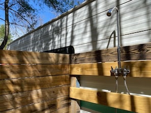 Enjoy a refreshing shower on the outdoor deck with a shower area.