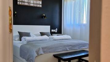 1 bedroom, desk, iron/ironing board, travel crib