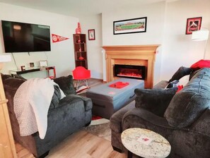 Smart TV, fireplace, books