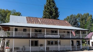 A two-story building with a sign reading "Idaho City Hotel". - The Idaho City Hotel (Idaho City)