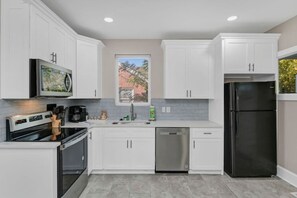 Fridge, microwave, oven, stovetop - Spacious Home on Gervais | 4BR 2BA | Downtown (Columbia)