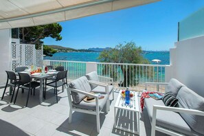 Outdoor dining - Stylish Seafront Apartment, Large Balcony Overlooking Sea & Beach on Pine Walk, Port de Pollenca! (Puerto de Pollensa)