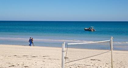 Enjoy beachside vibes at beautiful Henley Beach!