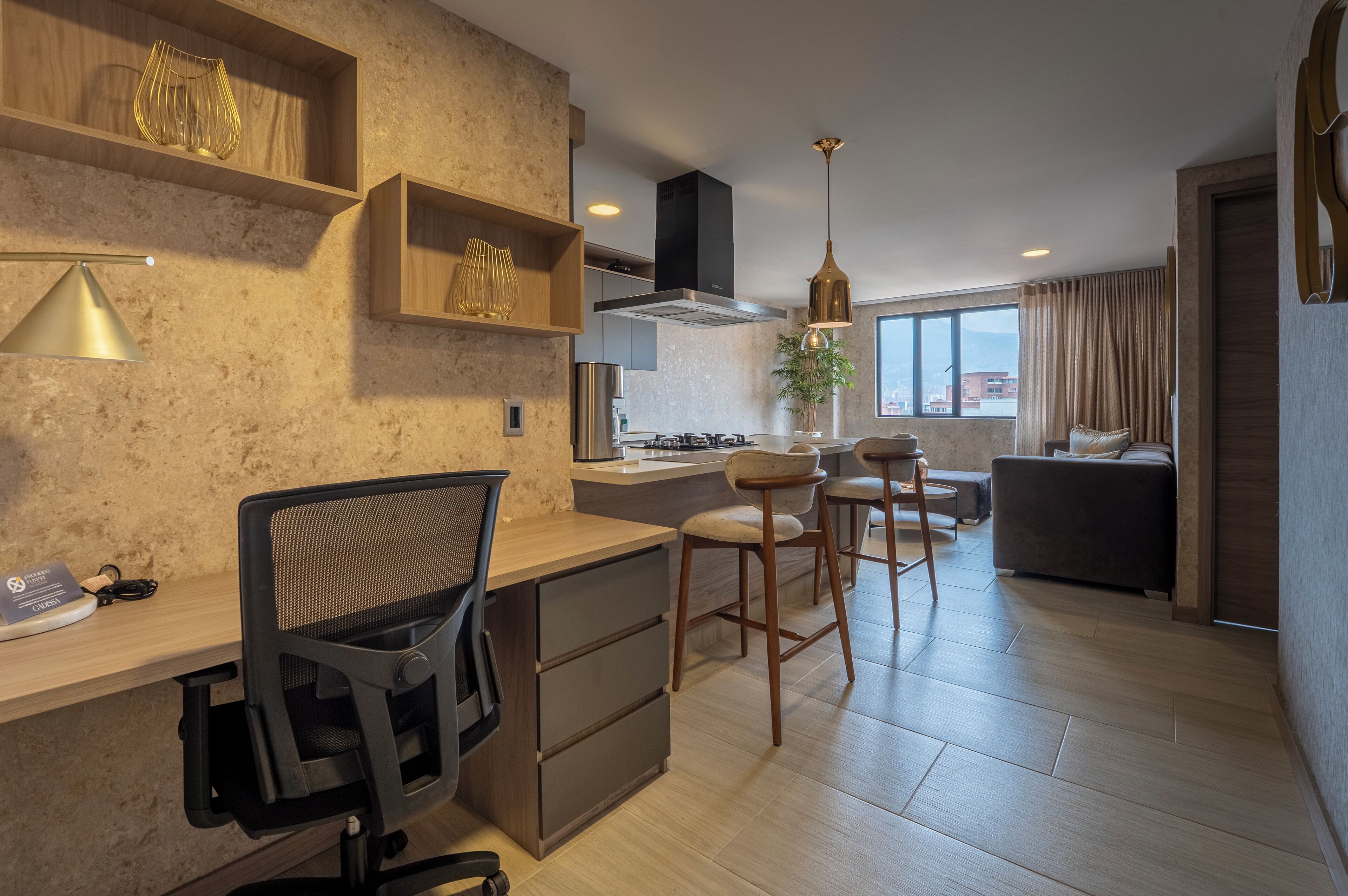 A modern kitchen with wooden shelves, a dining area with bar stools, and a view of the city through large windows.