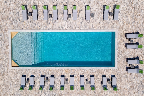 Outdoor pool, open 7:00 AM to 9:00 PM, pool umbrellas, sun loungers