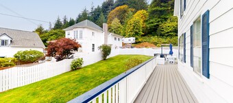 Spacious home with river views, hot tub, covered porch, deck, grill, & W/D