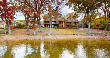 Lake-view townhome with private patio, rec room, & seasonal boat slip
