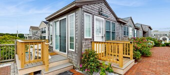 Quintessential coastal studio with beach access, BBQ area, patio, & water views