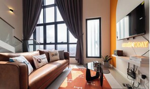 Deluxe Studio | Living area | 32-inch LCD TV with digital channels