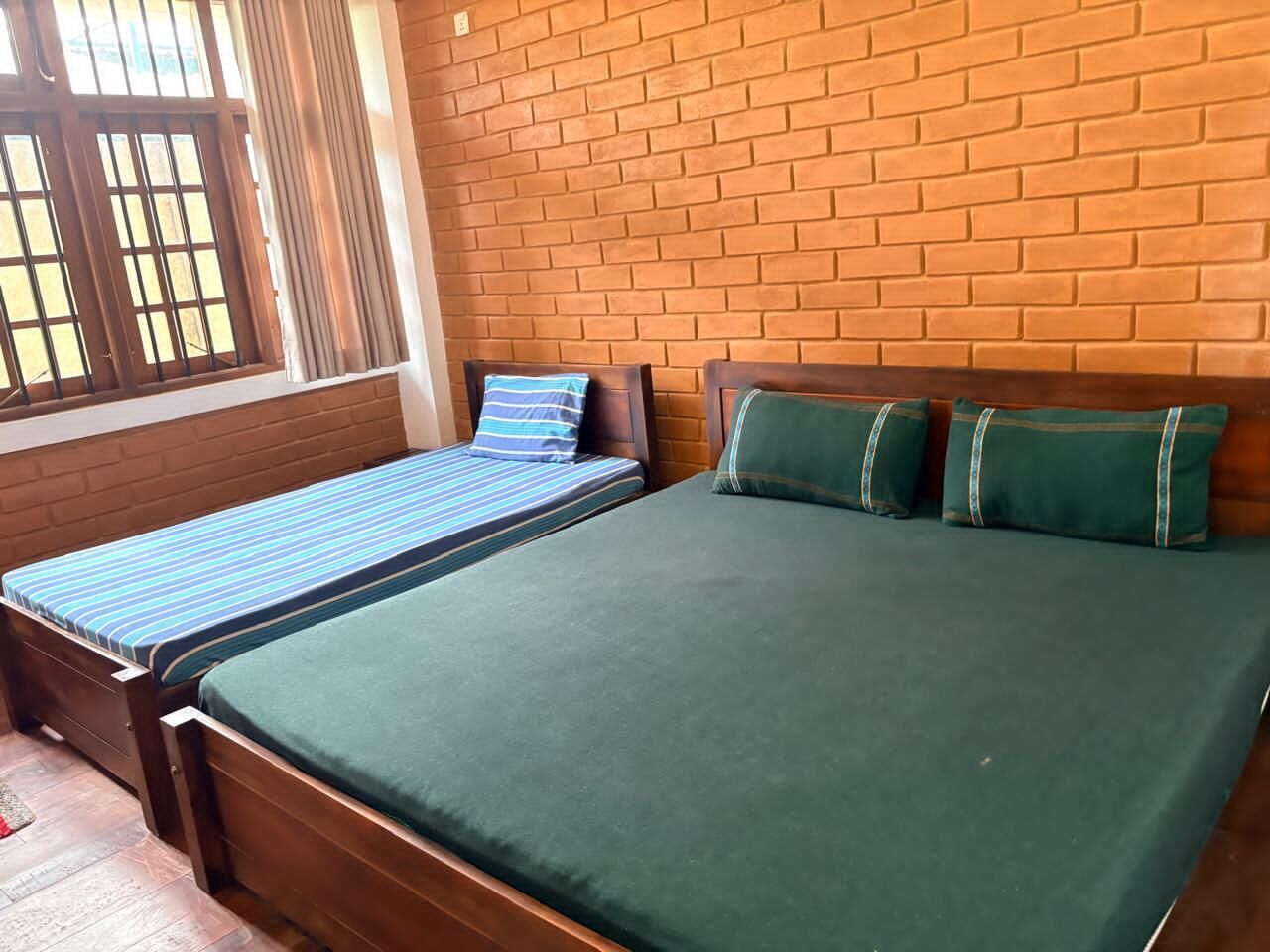 Basic Triple Room, Multiple Beds, Non Smoking, Hill View | Individually furnished, desk, laptop workspace, iron/ironing board