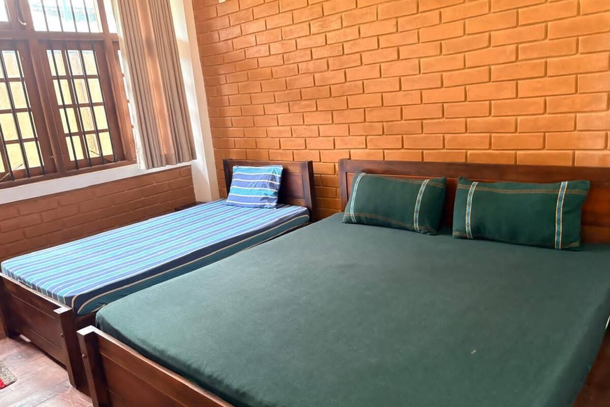Basic Triple Room, Multiple Beds, Non Smoking, Hill View | Individually furnished, desk, laptop workspace, iron/ironing board